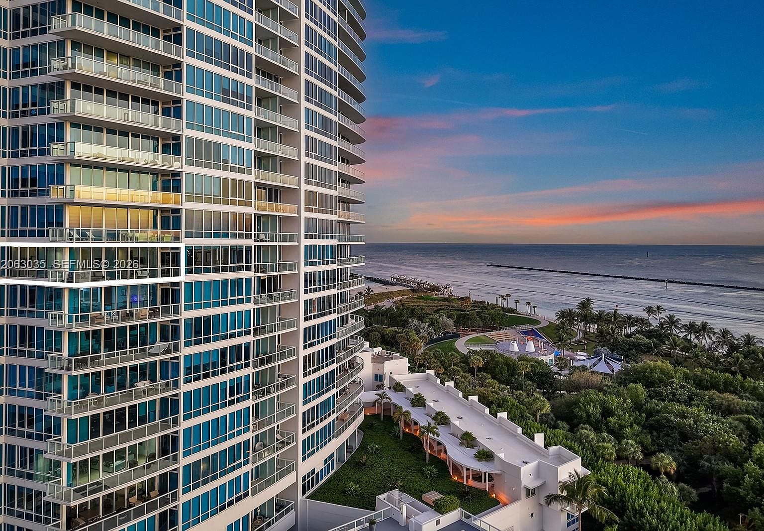Continuum South tower on the sand, oceanfront context