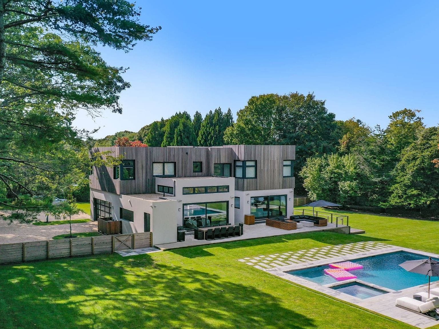 modern rear elevation with pool and lawn