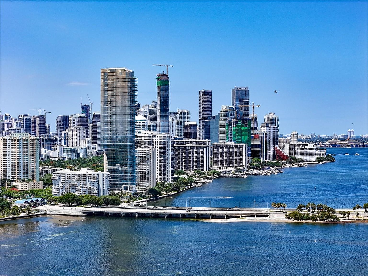 twilight panorama from the penthouse terrace over Biscayne Bay and the skyline