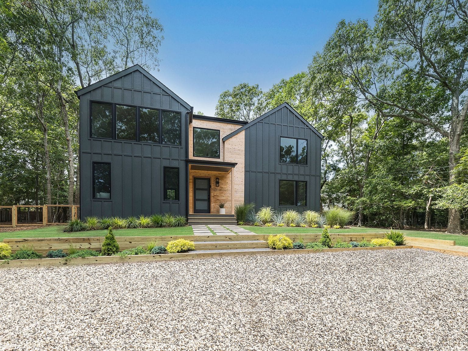 modern residence framed by mature trees