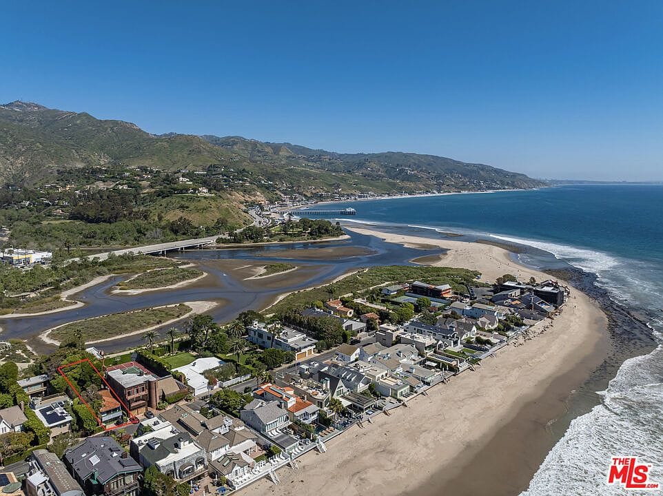 aerial of Malibu Colony with lagoon and surf