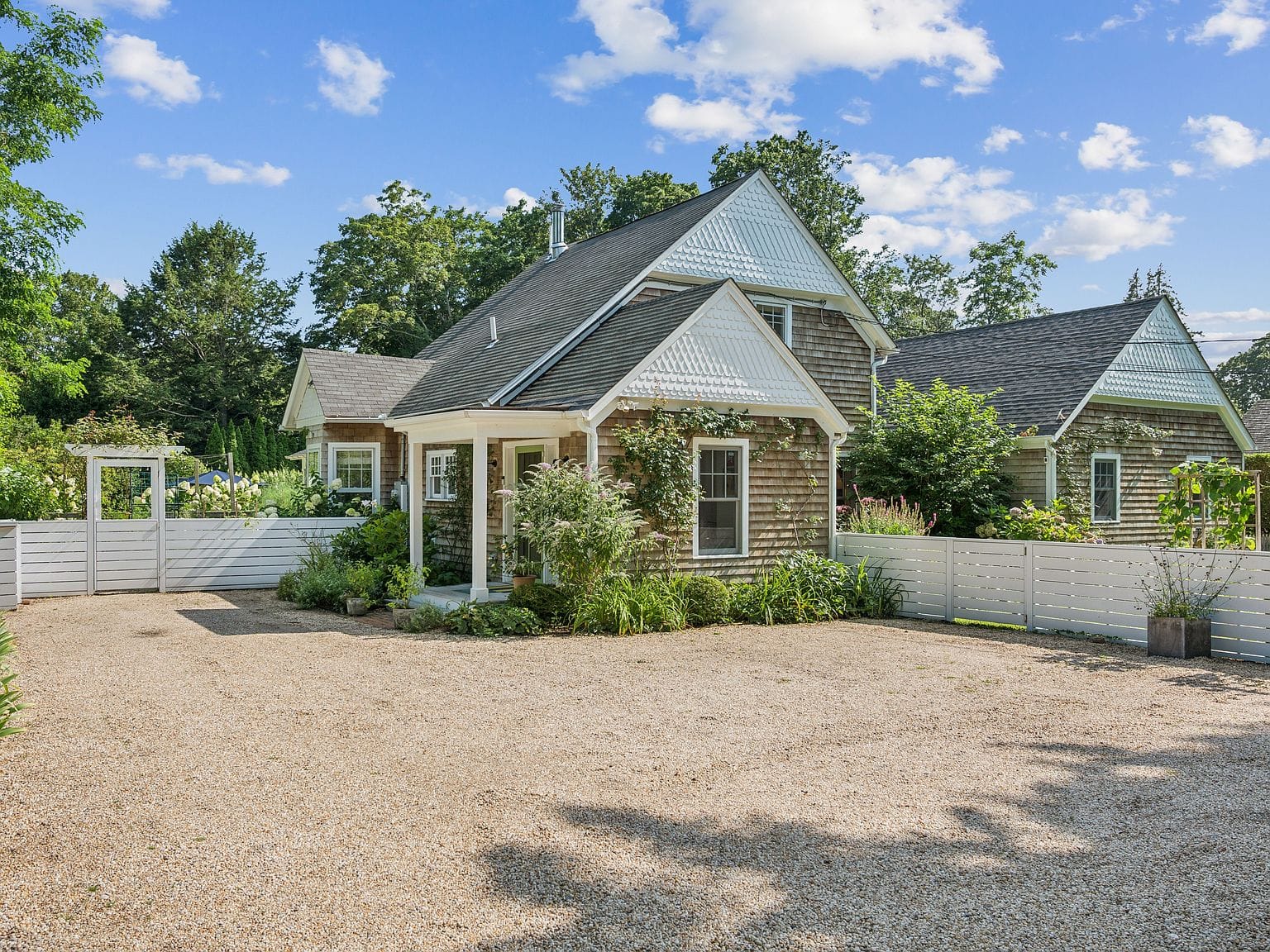 charming 1905 farmhouse facade and guest cottage