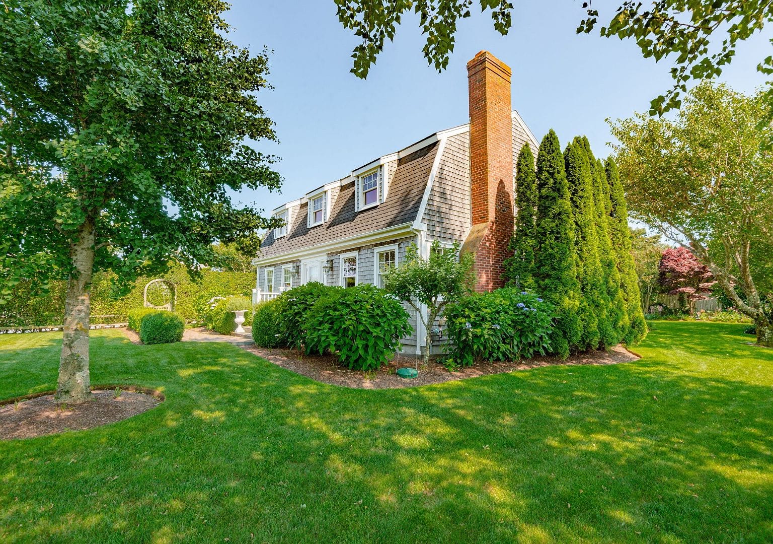 classic Nantucket facade across the front lawn
