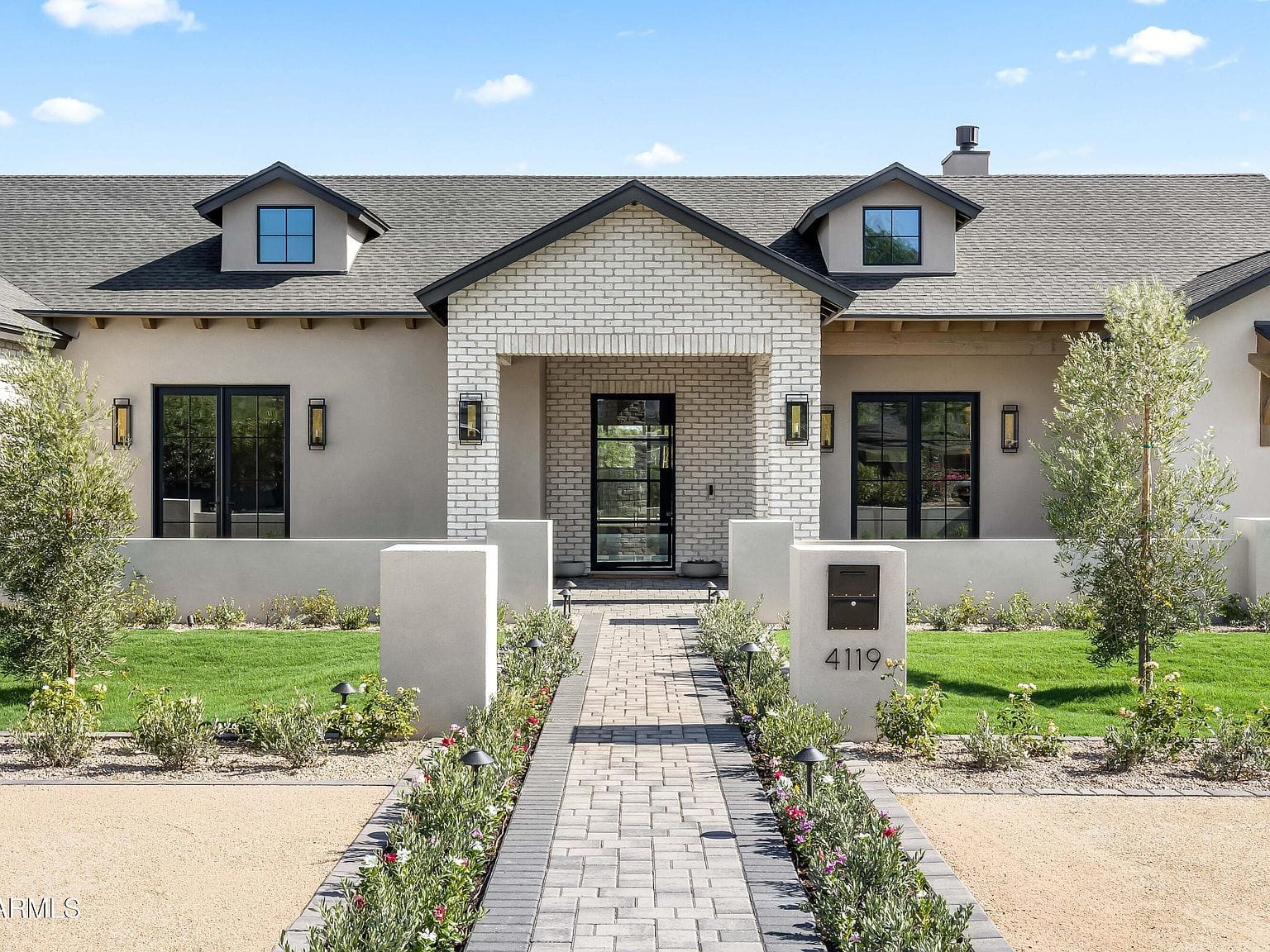 front elevation with paver walk and fresh landscaping