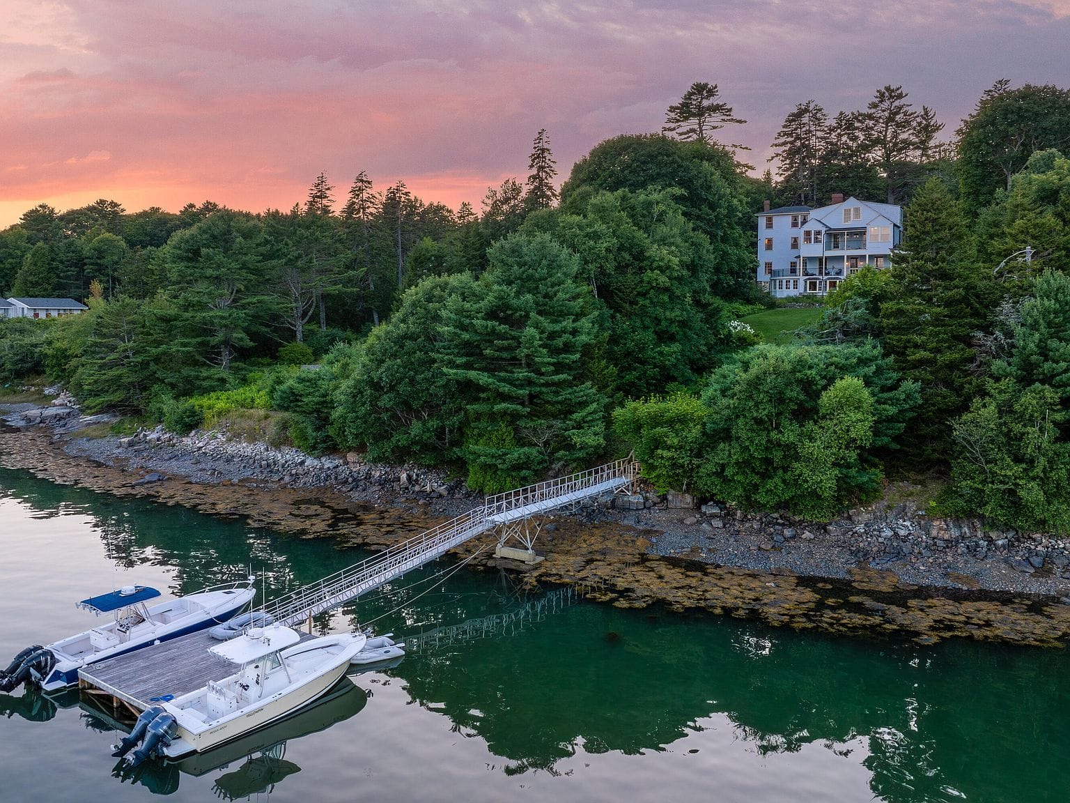 twilight aerial with Sweetbriar and the long dock on Northeast Harbor