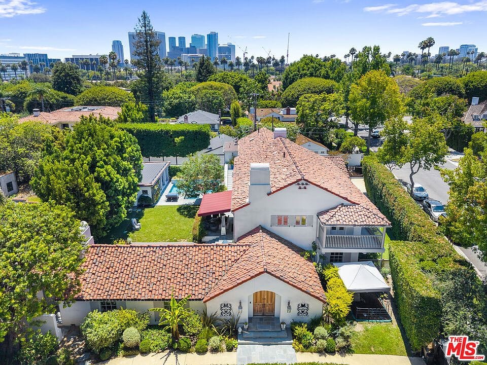 aerial over the estate with the Beverly Hills canopy and downtown skyline beyond