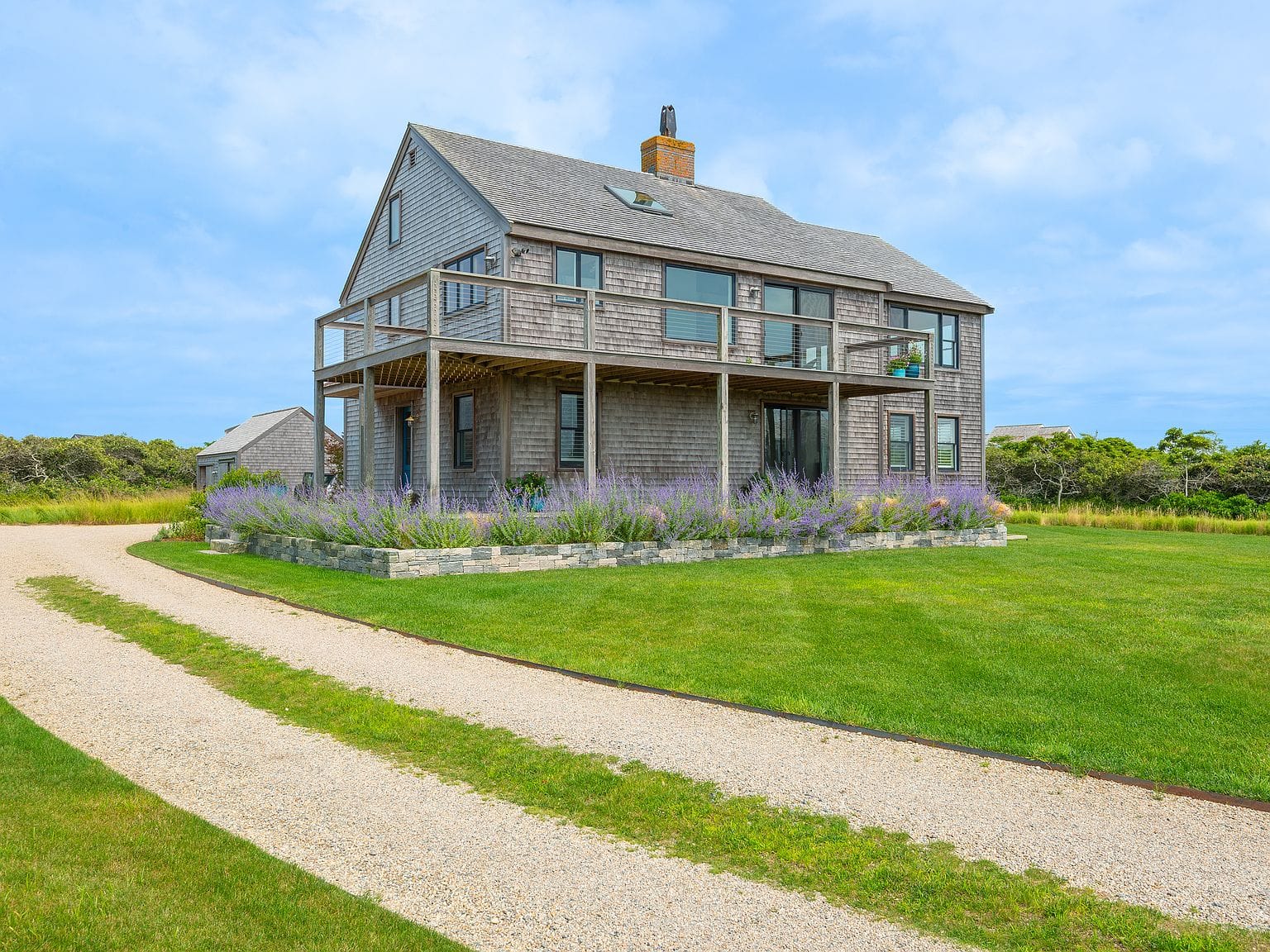 coastal residence framed by lawn and sky
