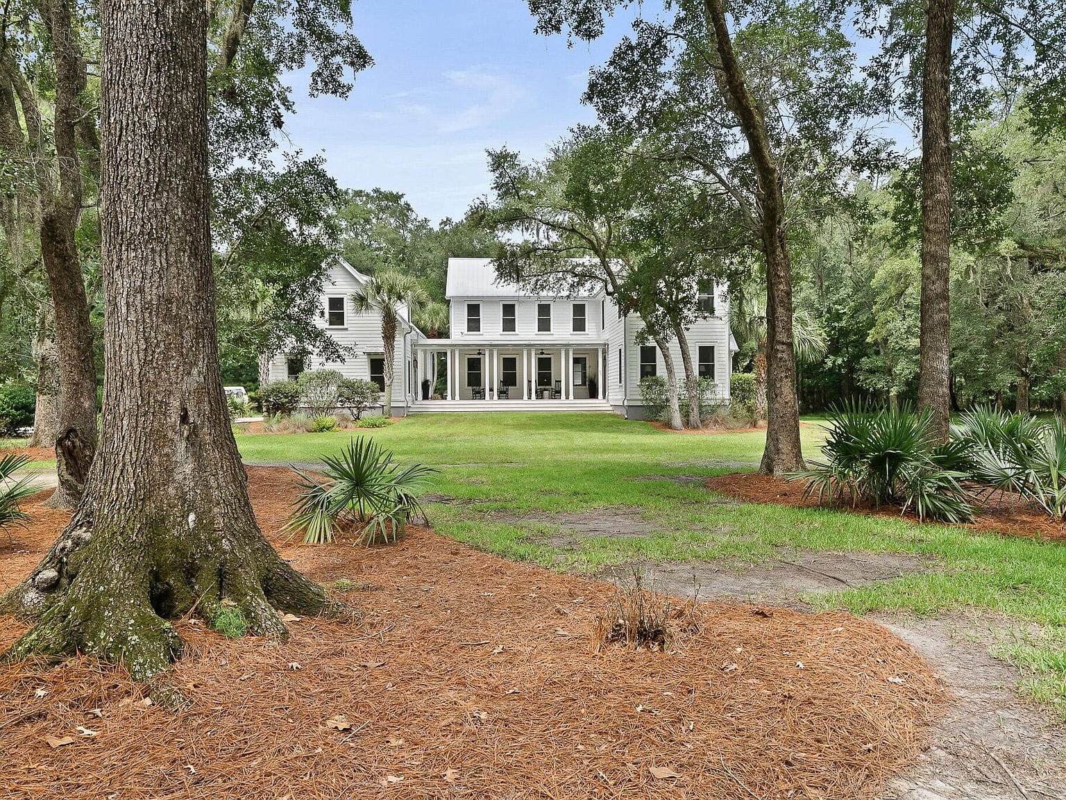 main residence beneath the live oaks