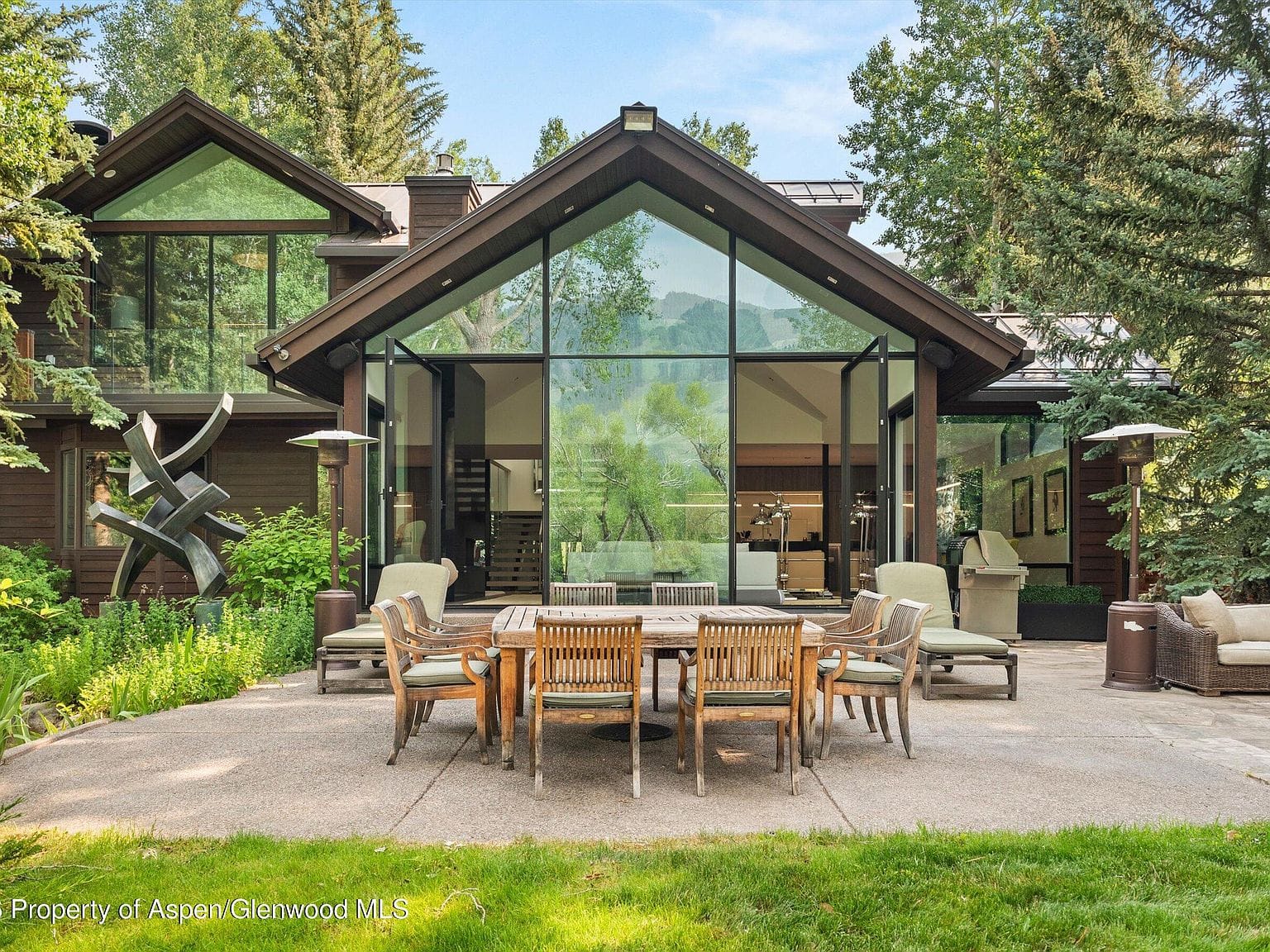 glass gable and lawn above the river